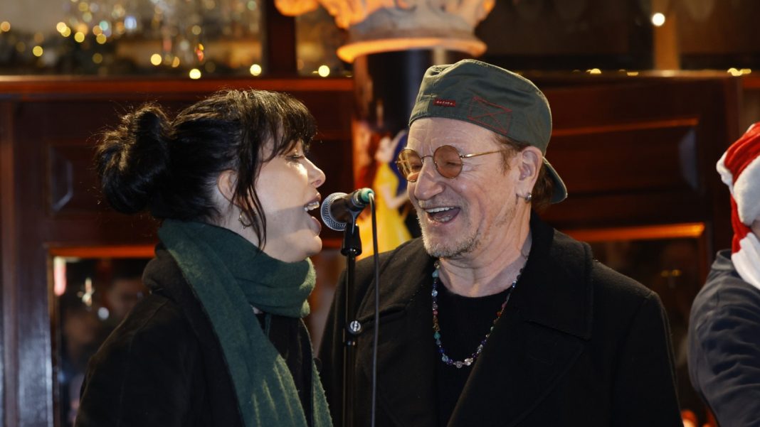Bono, Imelda May Sing ‘Christmas (Baby, Please Come Home)’ in Dublin