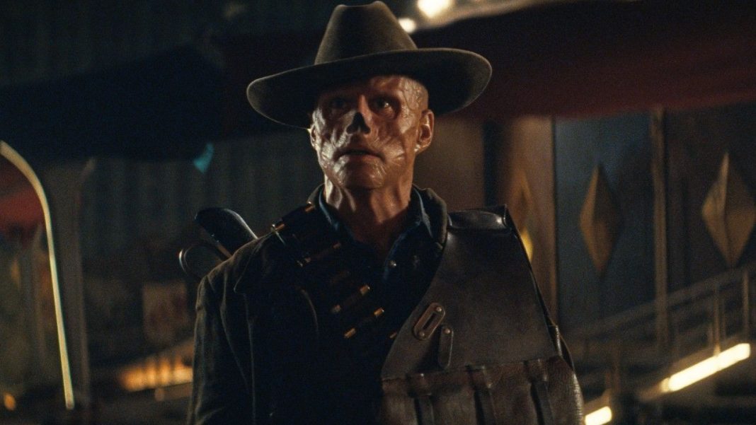 The Ghoul (Walton Goggins) looks at a Deathclaw on Fallout.