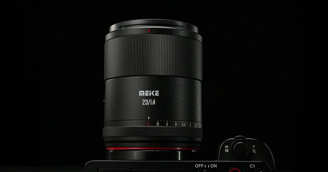 Meike Releases $290 AF 23mm f/1.4 Lens for APS-C Mirrorless Close-up of a MEIKE 25mm f/1.4 camera lens mounted on a camera body, with a black background and clear focus on the lens and control dials.