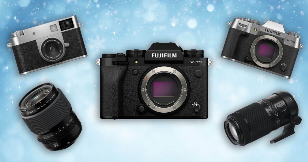 Take Advantage of These Great Fujifilm Deals Before They're Gone Four Fujifilm cameras and two camera lenses are arranged on a blue, snowflake-patterned background, with the Fujifilm X-T5 camera in the center.