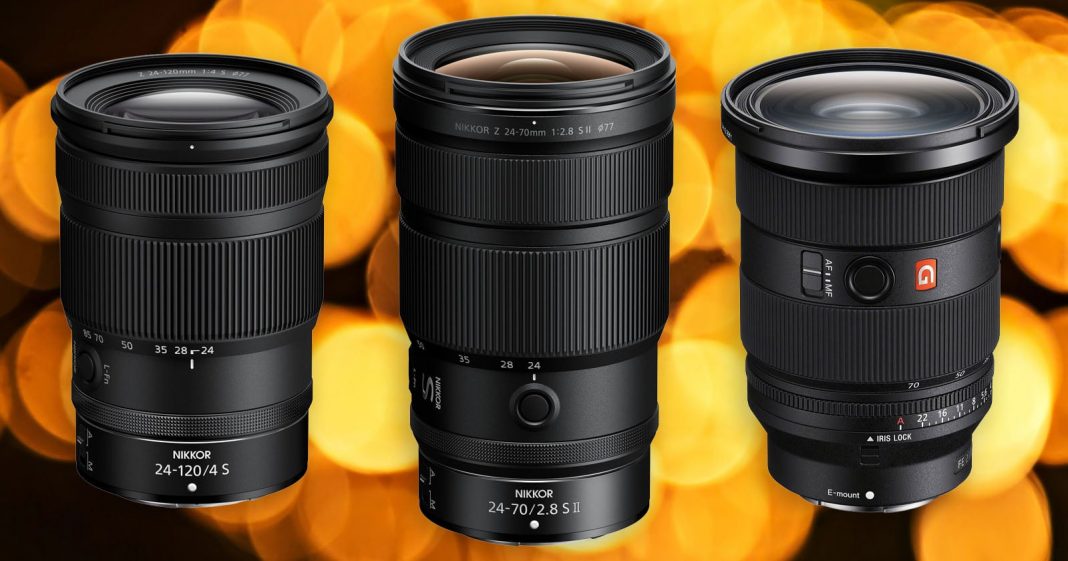 Three professional camera zoom lenses are shown standing upright side by side against a backdrop of large, out-of-focus golden lights. Each lens has visible brand and model markings.