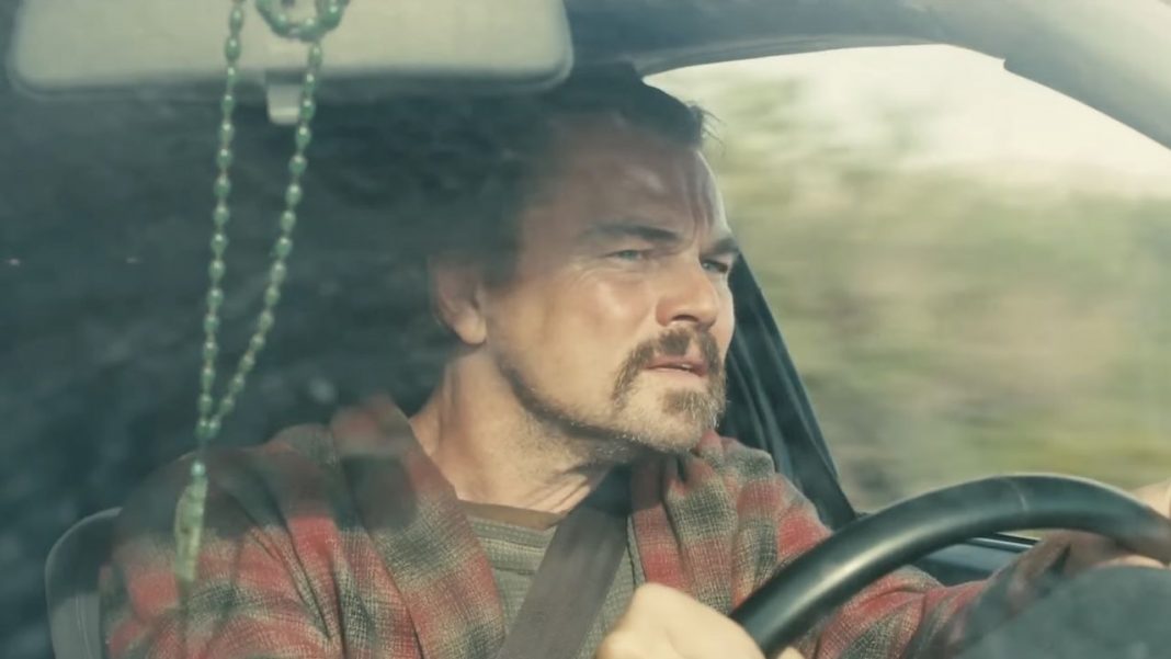 How Leonardo DiCaprio’s Mother (Allegedly) Has A Hand In His Leonardo DiCaprio driving on a sunny day in One Battle After Another
