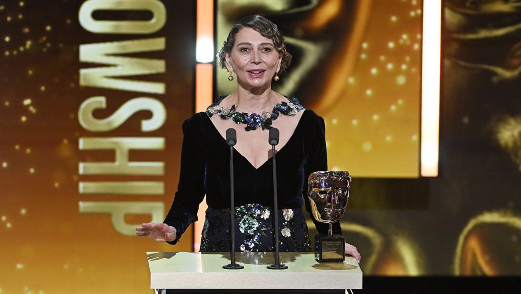 Dame Donna Langley accepts the Fellowship Award on stage during the EE BAFTA Film Awards 2026 at The Royal Festival Hall on February 22, 2026 in London, England.