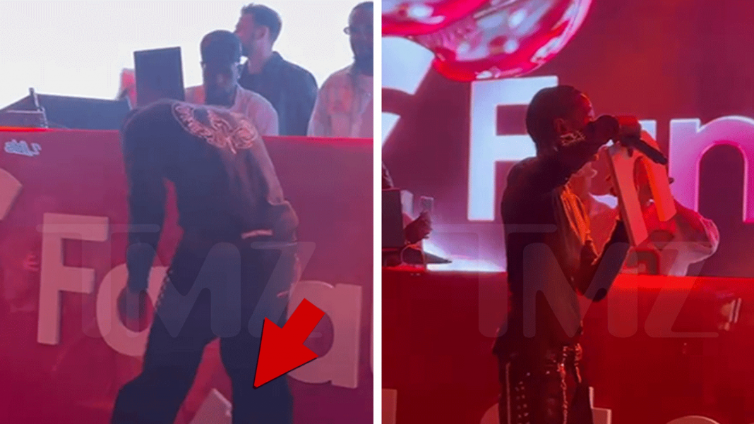Travis Scott Pulverizes Sign on Video During Pre-Super Bowl Performance Travis Scott Pulverizes Sign on Video During Pre-Super Bowl Performance