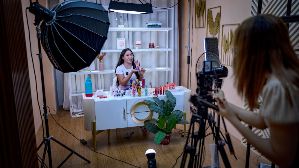 PULILAN, PHILIPPINES - JUNE 26: A live host promotes products for a skincare brand on a TikTok Shop livestream at one of the studios of Ownline Marketing on June 26, 2024 in Pulilan, Bulacan province, Philippines. Ownline Marketing, an agency that specializes in marketing brands on TikTok Shop and other e-commerce platforms, began only early this year with just one client but has quickly expanded to serving more than a dozen local and foreign brands, operating full production studios and delivering slick livestreams reminiscent of television home shopping channels. TikTok Shop, the e-commerce platform within the popular short video app, has spurred a booming live selling industry in the Philippines, where businesses are benefiting from TikTok's prized algorithm to sell more and faster, disrupting the market for other established e-commerce platforms in the region. However, a proposed bill in the Philippine Congress, House Bill 10489, introduced amid geopolitical tensions with China and following similar moves by other countries, aims to ban "foreign adversary-controlled" apps, likely targeting TikTok and could threaten the livelihoods of many Filipinos who have built their businesses on the platform​​​​. (Photo by Ezra Acayan/Getty Images)