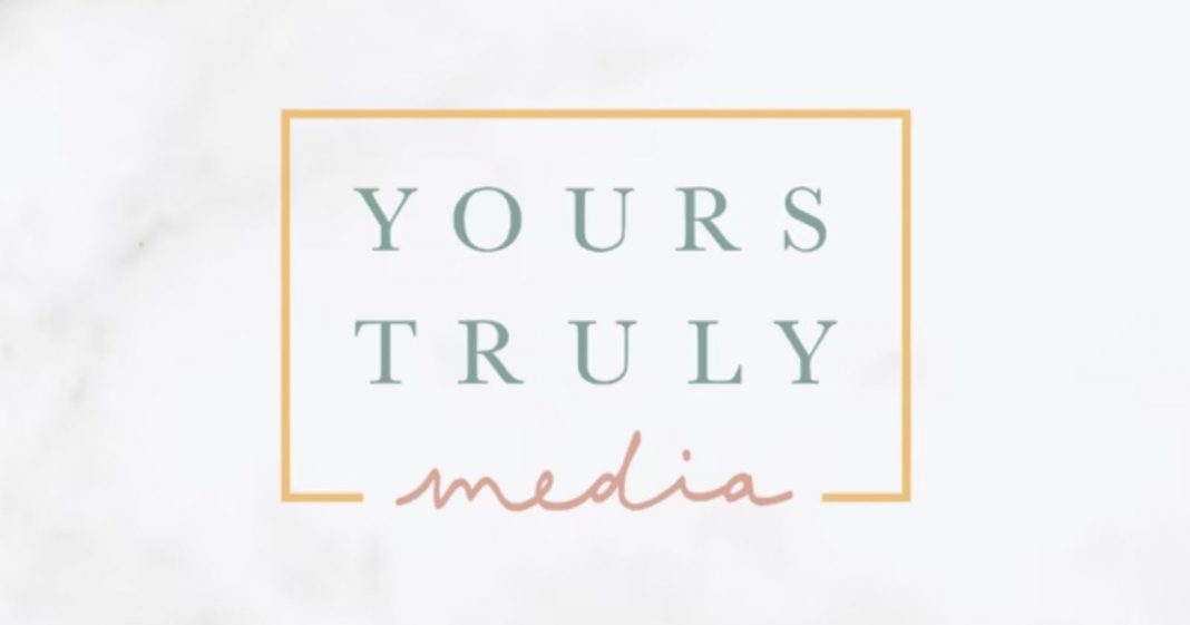 A logo with the text "YOURS TRULY" in green uppercase letters above the word "media" in pink script, all inside a yellow rectangular border on a light background.