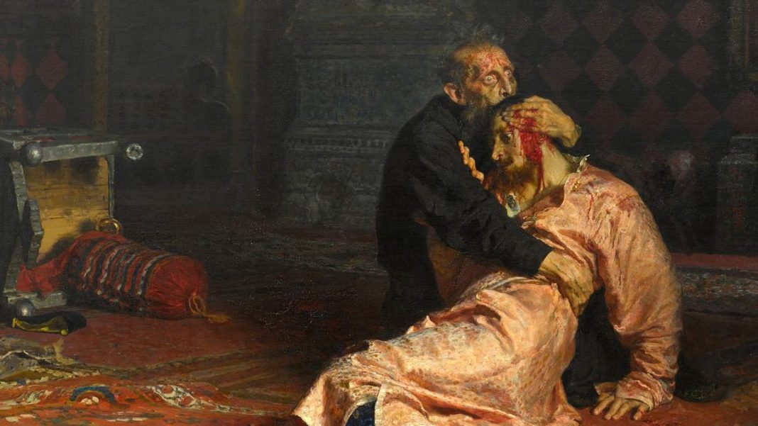 Painting of a distressed man with wide eyes holding a dying man with a bloody head. They lie on a red pattered carpet near a toppled throne, dark, rich tones in the background.
